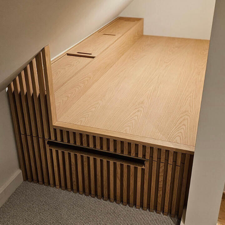 Bespoke commissioned meditation bed with large pull-out storage drawer. Made with hand-selected solid oak and veneers. Custom one-off handmade brass pull handle with patinated leather. Crafted by Fundi Joinery in Edinburgh, Scotland