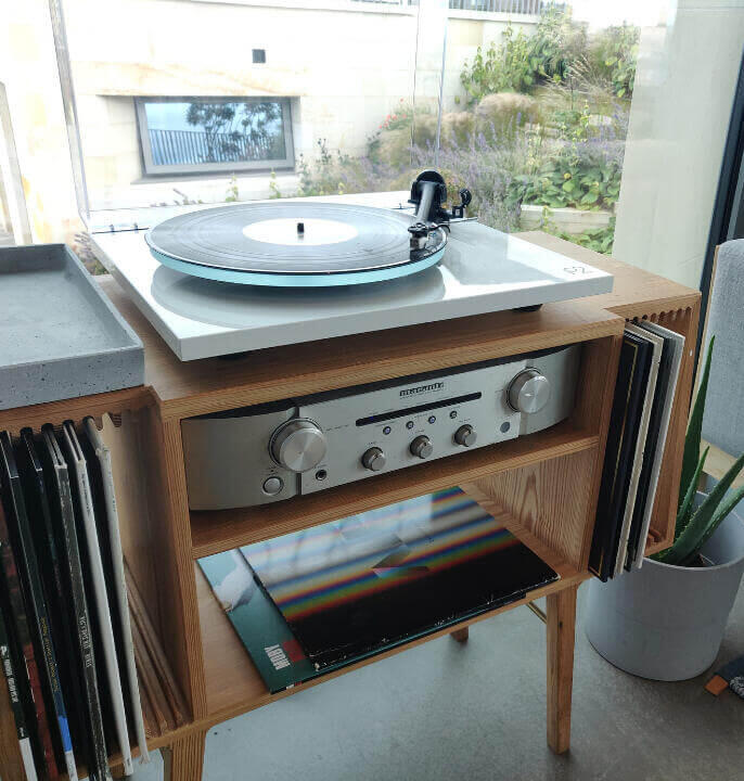 Commissioned bespoke mid-century record player cabinet made from old reclaimed pitch pine timber with unique vinyl storage. made by Fundi Joinery in Edinburgh, Scotland