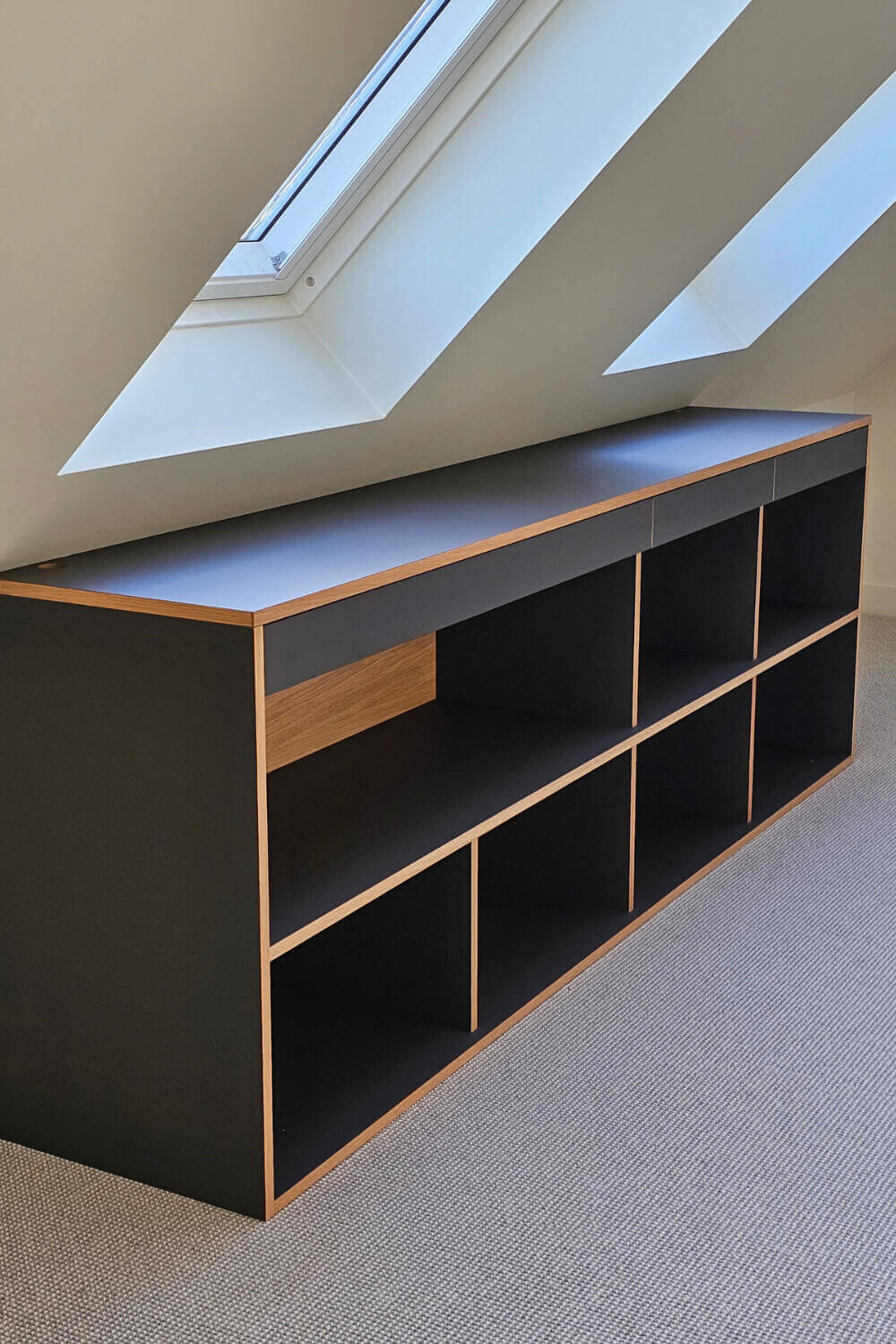 Bespoke commission of a minimalist open shelving unit with a pull-out desk and drawers. made by Fundi Joinery in Scotland
